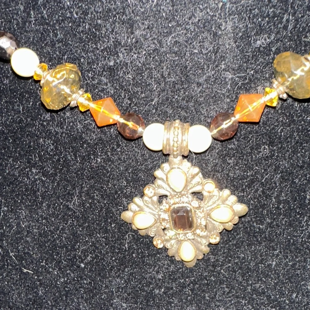 Elegant Paisley Silk Tie with Gold rhinestone snake on beaded necklace.